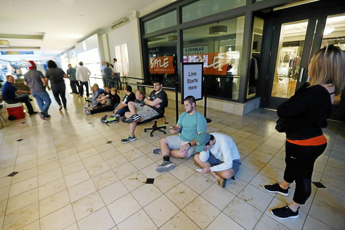 Photo Gallery People line up early for iPhone 6S Work & Money