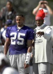 Cornerback Deion Sanders of the Dallas Cowboys prays while