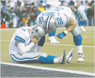 Dallas Cowboys holder Tony Romo (right) can't get the ball placed for  kicker Martin Gramatica to attempt a field goal against the Seattle  Seahawks late in the fourth quarter of NFC Wild-Card