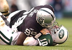 Jerry Porter of the Oakland Raiders runs with the ball after a