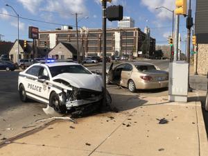 Police cruiser appears totaled after crash downtown Friday morning