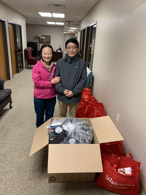 Tian and Liying delivering masks