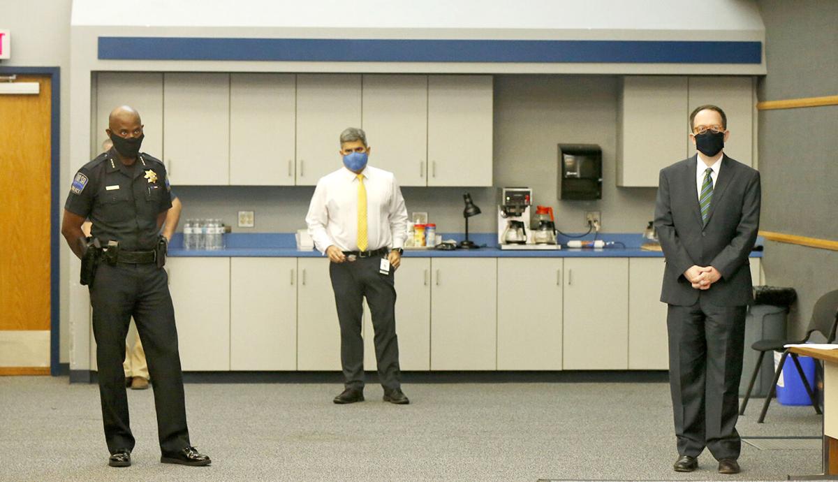 Masked officials in Tulsa