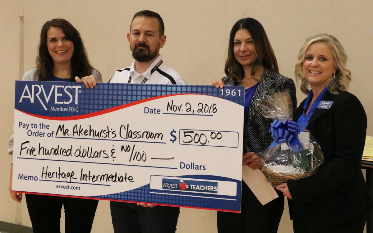 Arvest Bank makes contribution to Coweta educator News