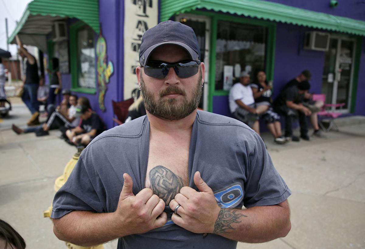'I was young and dumb': Tattoo parlor's promotion to cover hate, gang