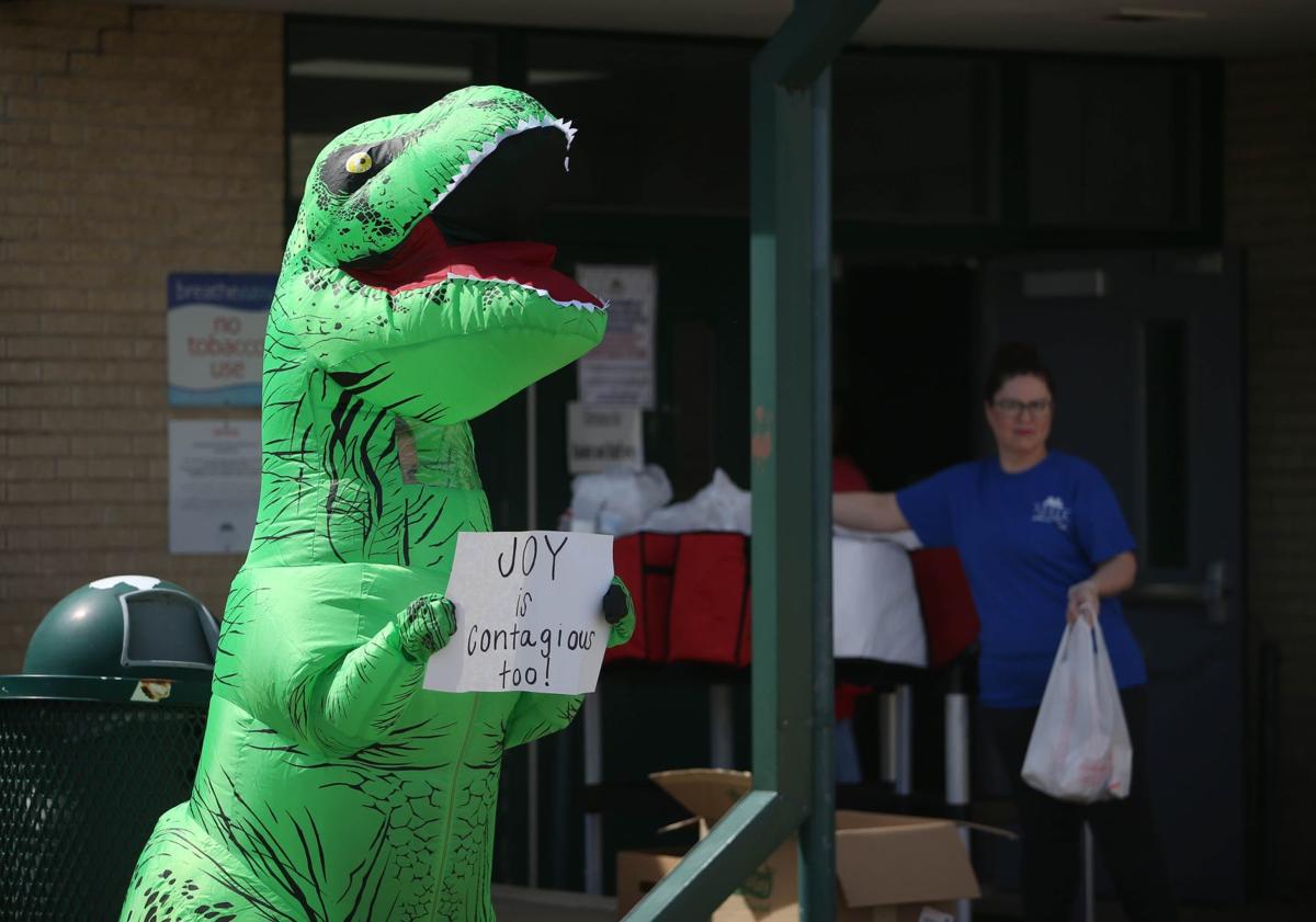 Look For The Helpers T Rex Costume Is Dino Mite Way Of Bringing Joy To Tulsa Neighborhood Latest Headlines Tulsaworld Com