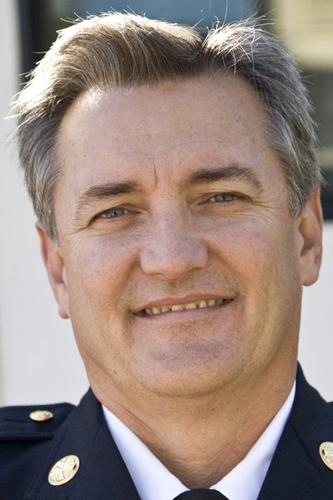 Wife charged with murder in fire chief's death