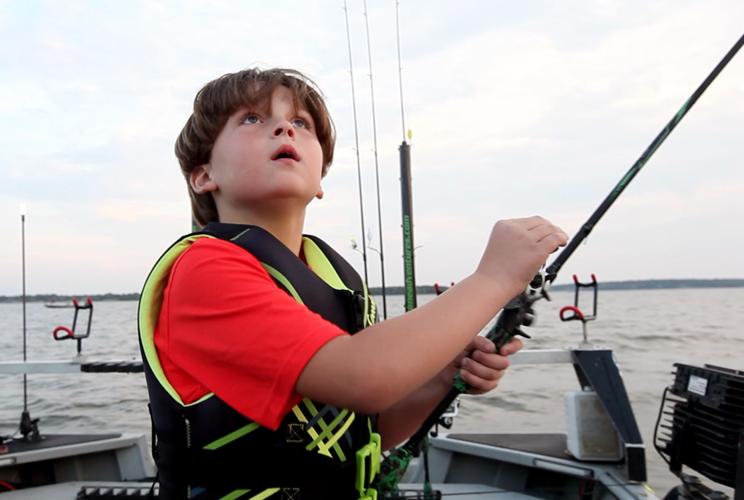Fishing fascination, guide's patience provide autistic boy with fun  experience (copy)