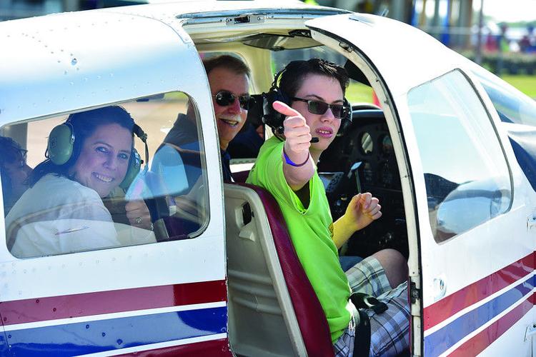 Special needs youth fly high, piloting planes at Challenge Air Fly Day at Tyler airport