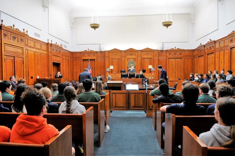 Local eighth graders participate in mock trial inside federal