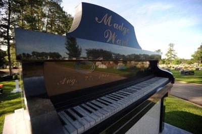 Music teacher’s grave marker a grand piano mausoleum