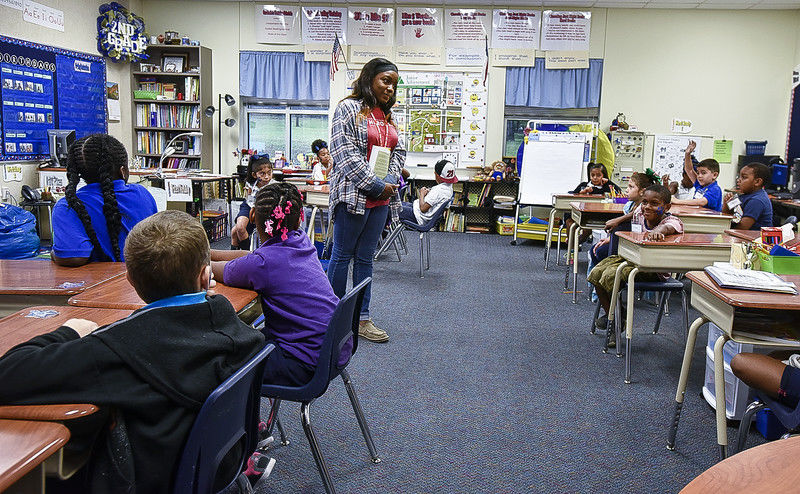 Volunteers take over the classroom to teach financial literacy for ...