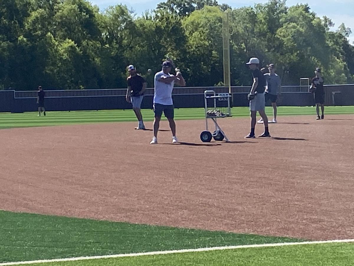 Whitehouse putting in work on the baseball field, in the batting cages