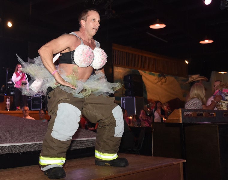 Firefighters show off in bras to benefit cancer charity and fire