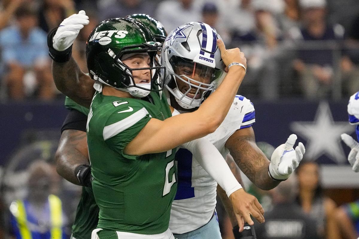 Dallas Cowboys quarterback Dak Prescott looks to pass during the first half  of an NFL football game against the New York Jets, Sunday, Sept. 17, 2023  in Arlington, Texas. (AP Photo/Sam Hodde