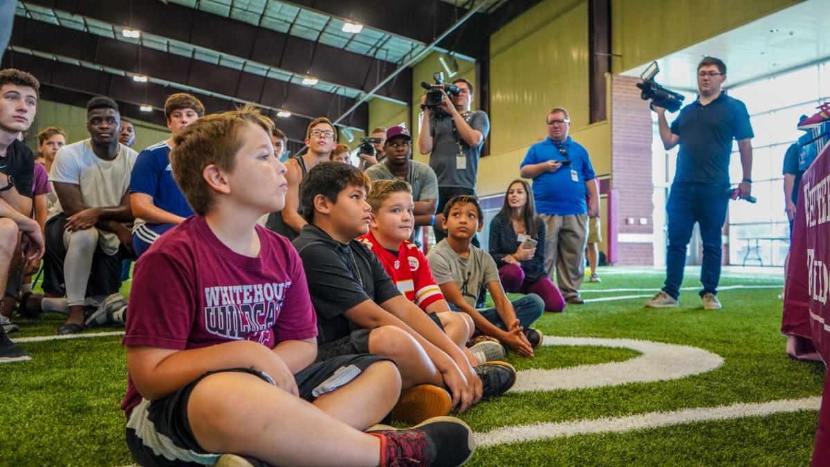 Patrick Mahomes' brother, Jackson, presents shoes to Whitehouse ISD on behalf of the 15 and the ...