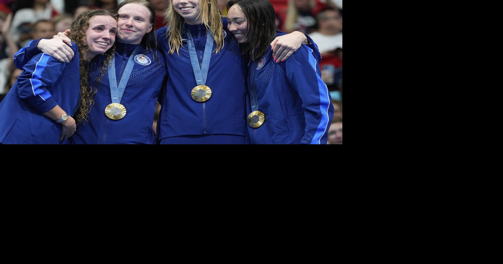 On a wild final night of swimming, U.S. sets two world records, edges