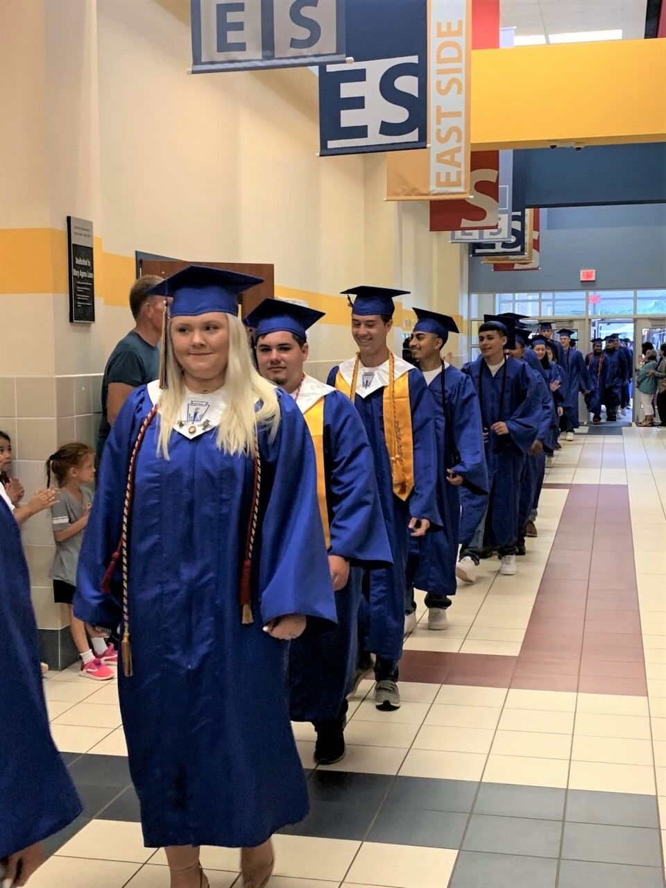 Jacksonville High seniors don caps, gowns for graduation walk at their