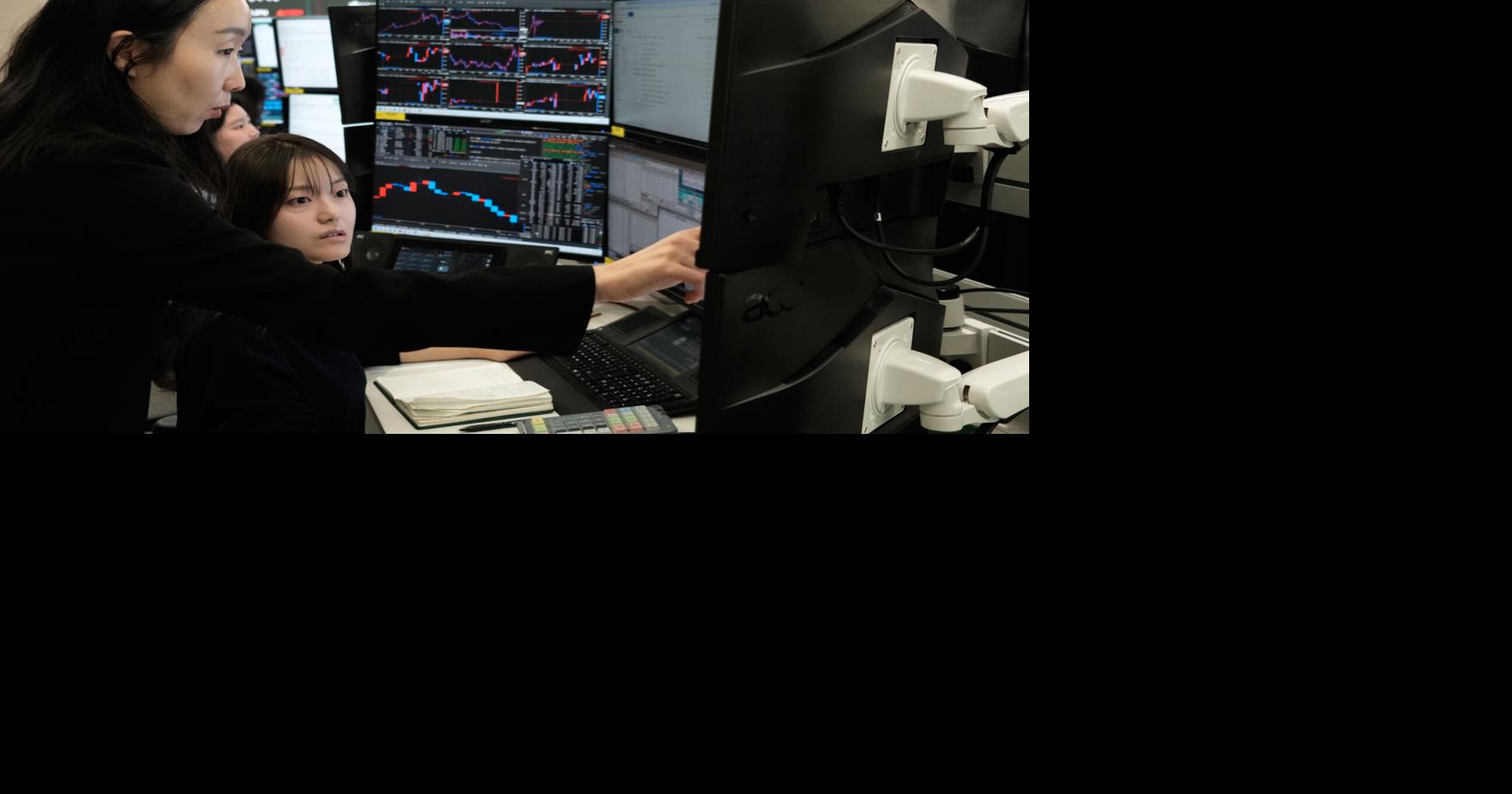 Asian shares mostly gain while European trading stays closed for a holiday