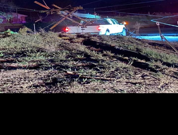 Driver hits utility pole and stop sign, causes power ...