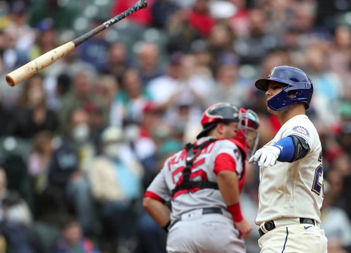 Seattle Mariners' Ty France looks down after striking out to end