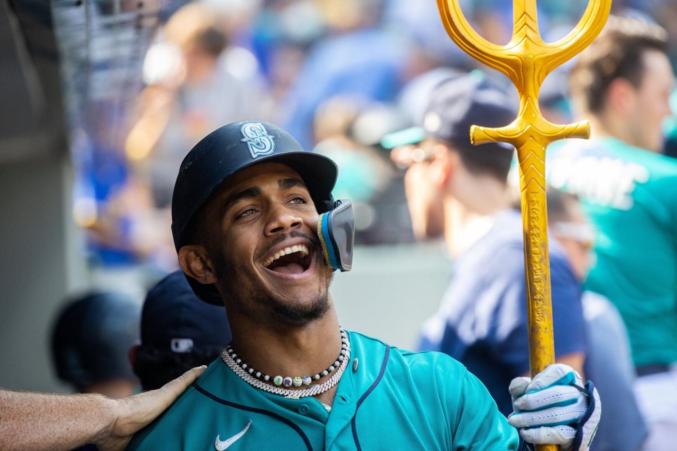 Seattle Mariners Vs. New York Mets Seattle Mariners Teoscar Hernandez 35 is  handed the trident after