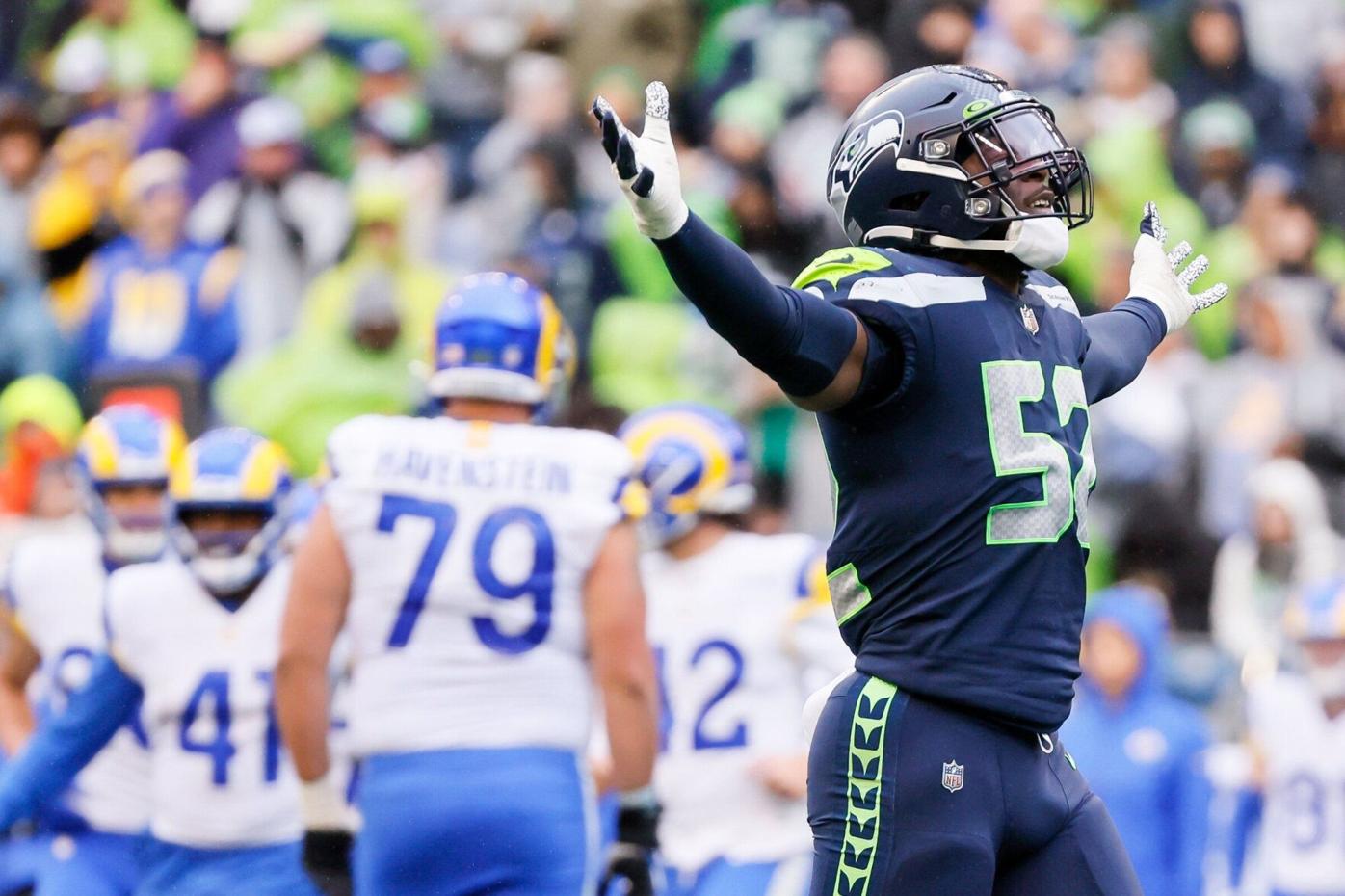 Seahawks LB Darrell Taylor runs onto the field after an