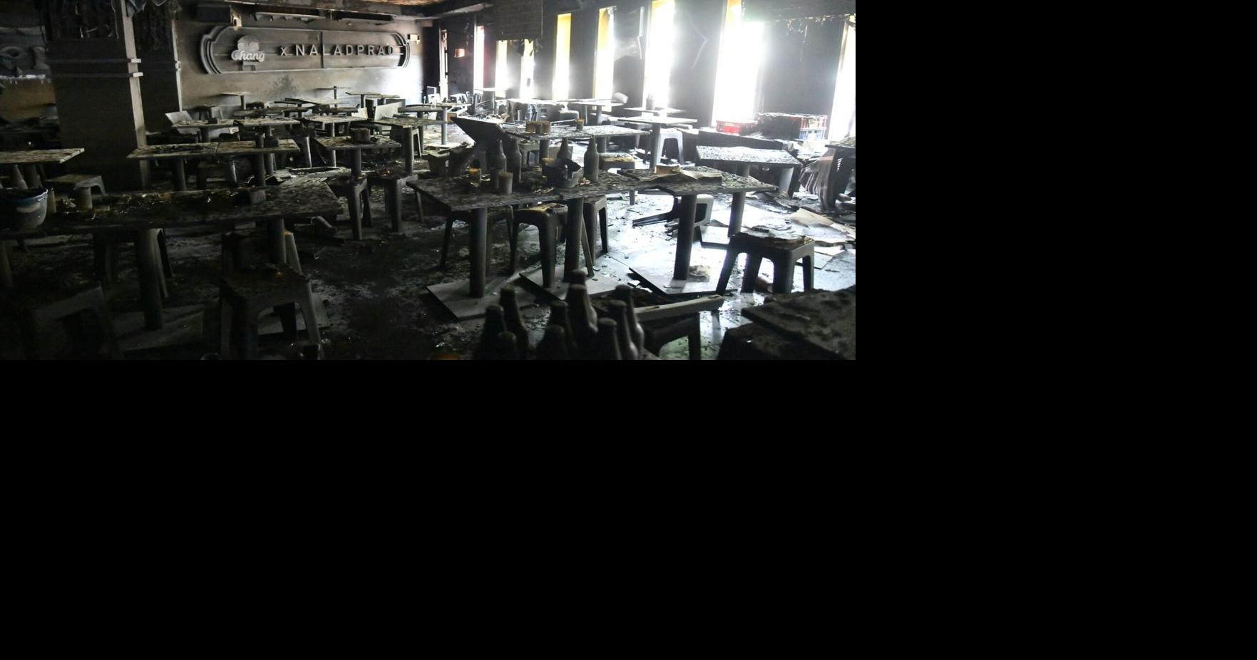 Investigators probe a fire at a music bar in Bangkok that killed at least 27 people