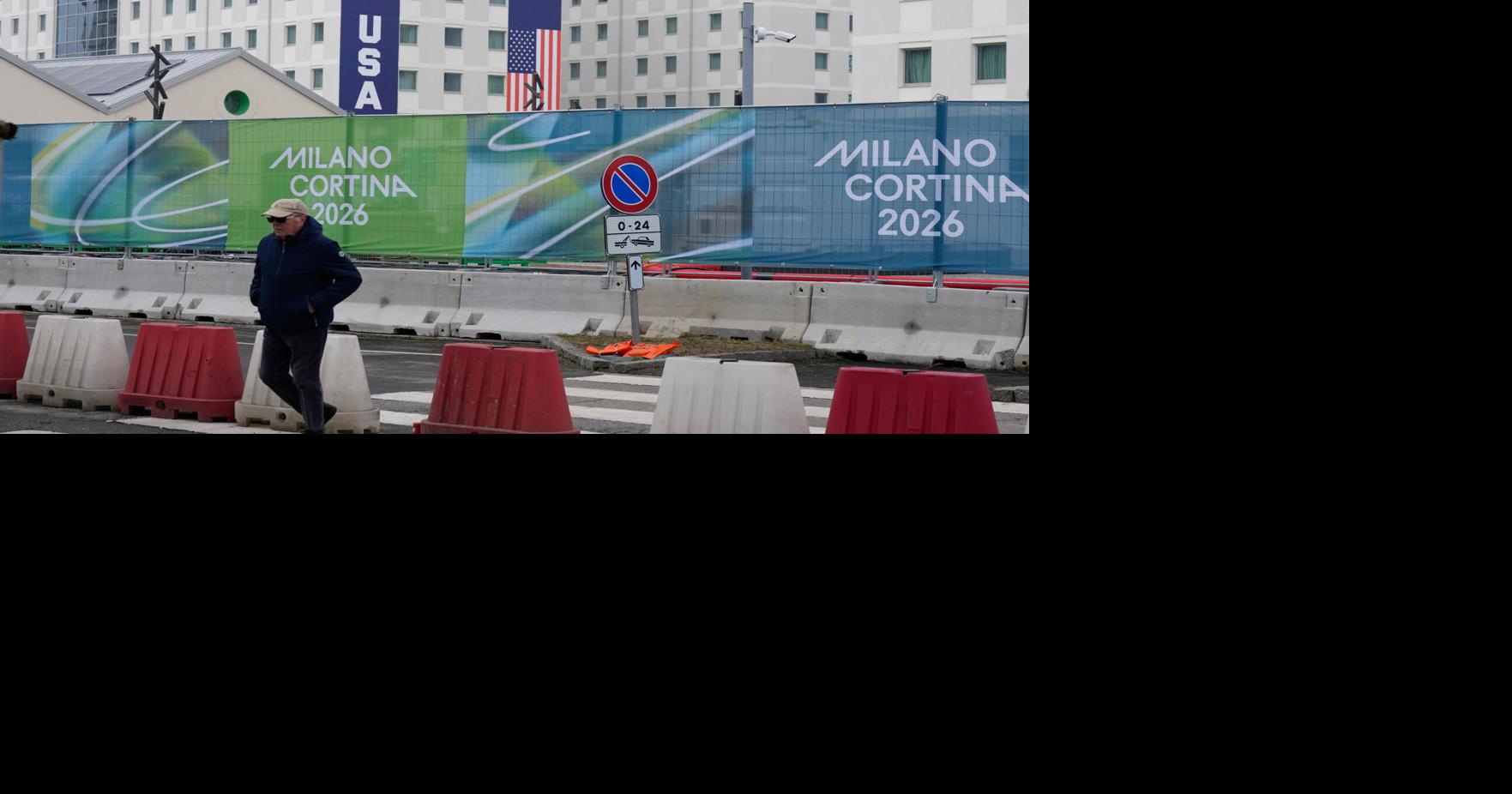 Athletes bring Milan Olympic Village to life, complete with Italian bidets and 4-story US banners
