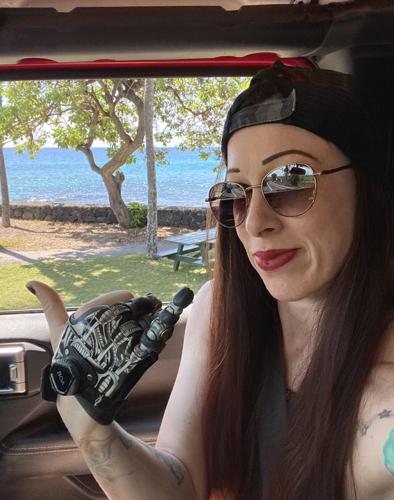 'Bionic Angie': Crystal Falls amputee uses prosthetic fingers to ...