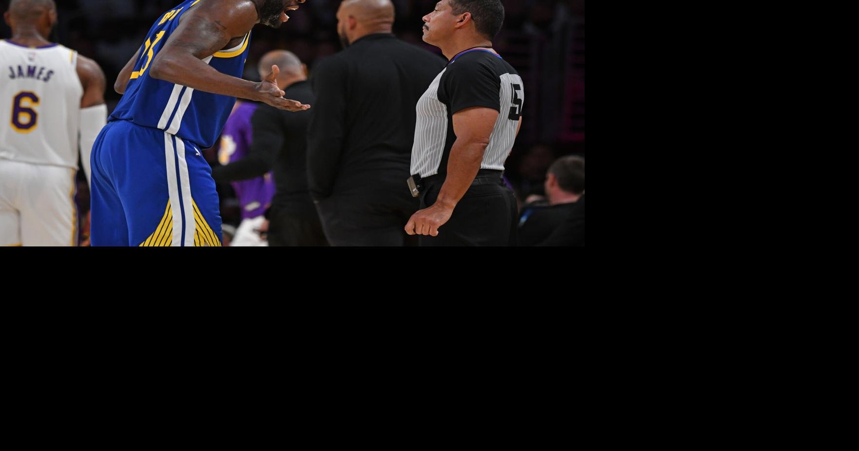 Referee Scott Foster runs up court during the first half of an NBA  basketball game between the Detroit Pistons and the Los Angeles Lakers,  Sunday, Nov. 21, 2021, in Detroit. (AP Photo/Carlos