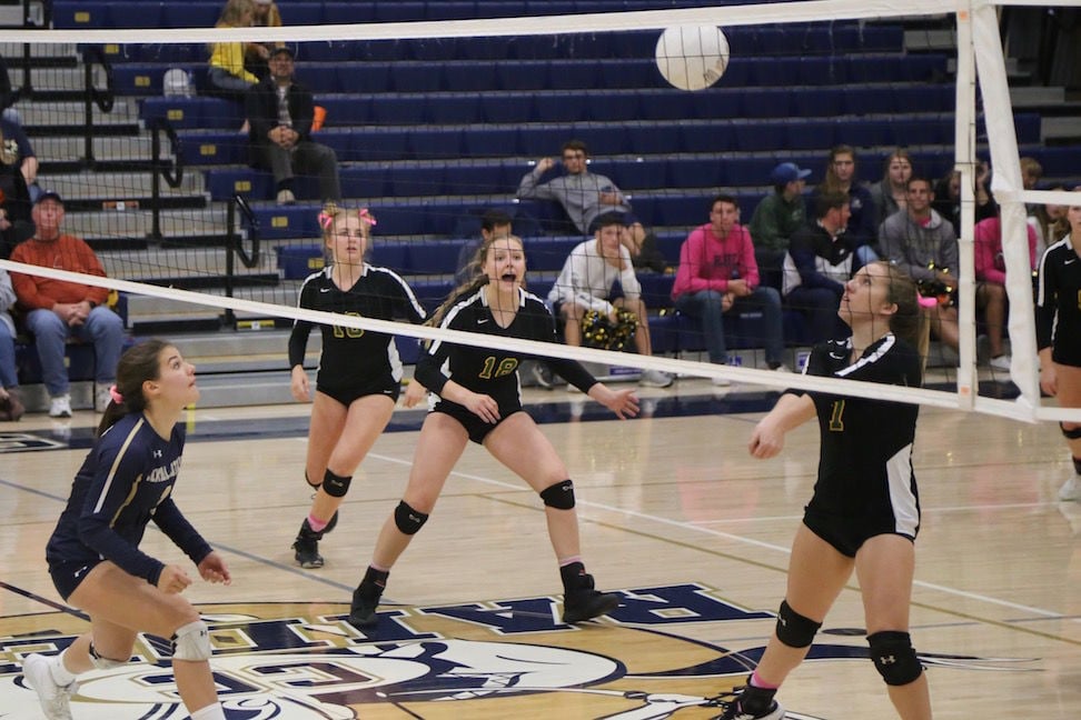Sonora Wildcats varsity volleyball players Jacey Hawkins, number 16, Hope Houck, number 18, and Mandy Teem, number 7, build an attack Thursday night on Central Catholic in a second-round match of the 2019 CIF Sac-Joaquin Section Volleyball Division III playoffs in Modesto.