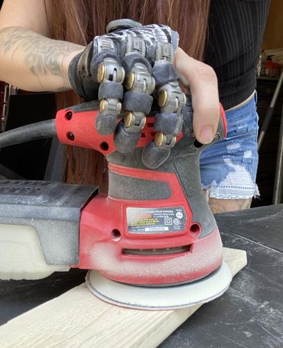 'Bionic Angie': Crystal Falls amputee uses prosthetic fingers to ...