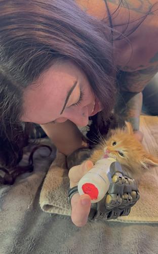 'Bionic Angie': Crystal Falls amputee uses prosthetic fingers to ...