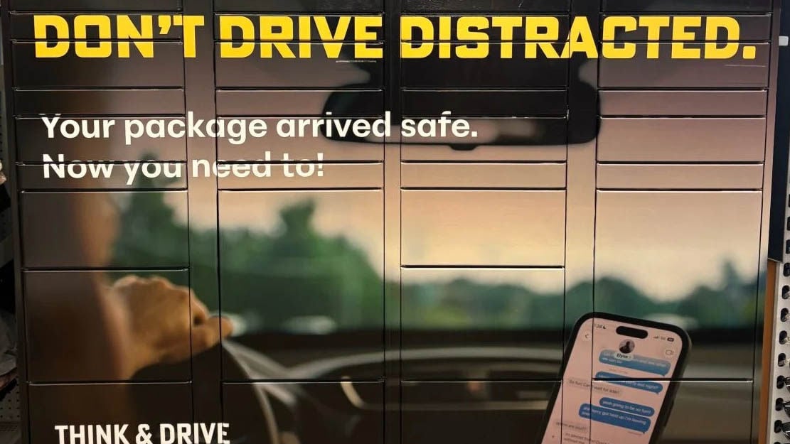 A distracted-driving display shows a phone in a car beneath the words “Don’t Drive Distracted.”