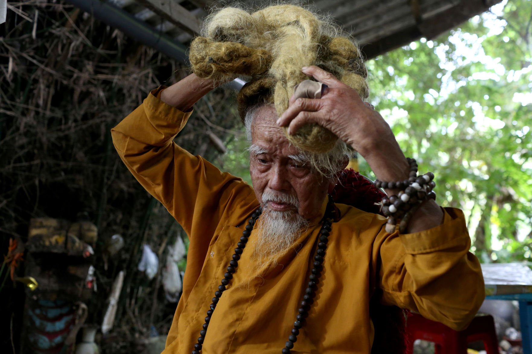 Vietnamese man with 16 feet of hair says lifelong grow-out is ...