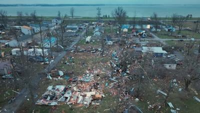 Damage from tornadoes is revealed in the morning light after tornadoes ripped through the Indian Lake area of Logan County
