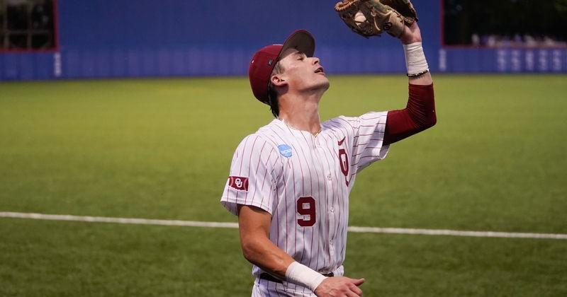 Oklahoma Sooners Camden Johnson (9) makes a catch against Kansas Jayhawks during the NCAA Lawrence Super Regional game at Hoglund Ballpark on June 7, 2026.