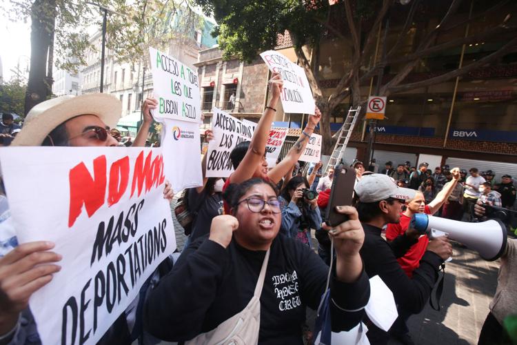 Pro-migration demonstrators protest during the North American Leader's Summit, in Mexico City
