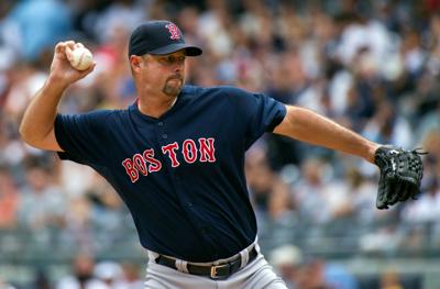 FILE PHOTO: Boston Red Sox starting pitcher Wakefield throws to New York Yankees during their MLB American League baseball game at Yankee Stadium