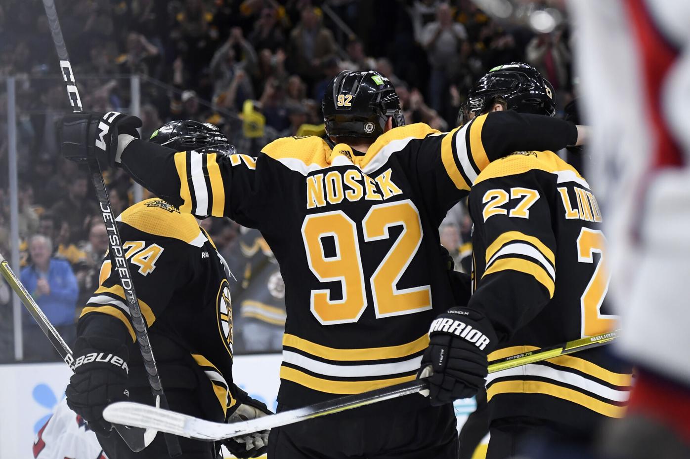 Boston Bruins' Linus Ullmark, left, celebrates with fellow goalie
