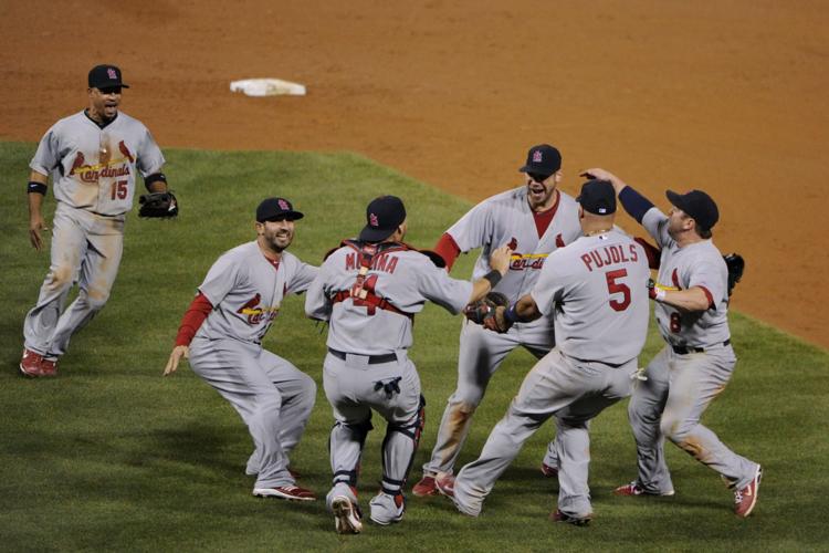 Carpenter throws three-hit shutout as Cardinals upset Phillies to