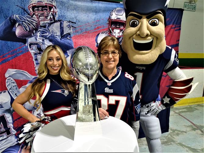 Dented Super Bowl trophy draws hundreds to Dover arena