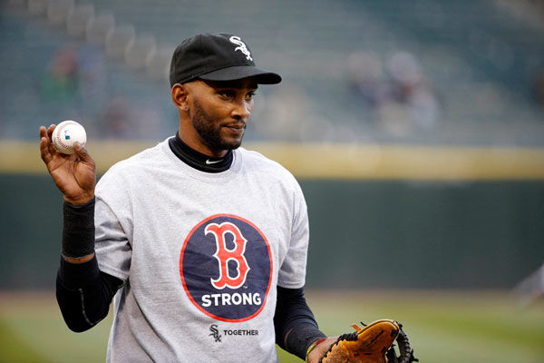 Chicago White Sox shortstop Alexei Ramirez wears a Boston Strong tee shirt  as he warms up before the game against the Boston Red Sox at U.S. Cellular  Field on April 15, 2014