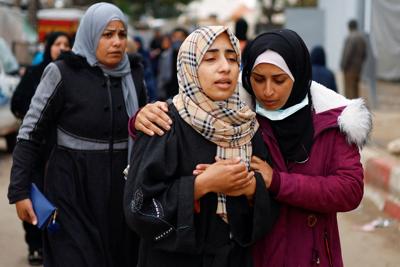 Mourners react near the bodies of Palestinians killed in Israeli strikes, at the European hospital in Khan Younis in the southern Gaza Strip