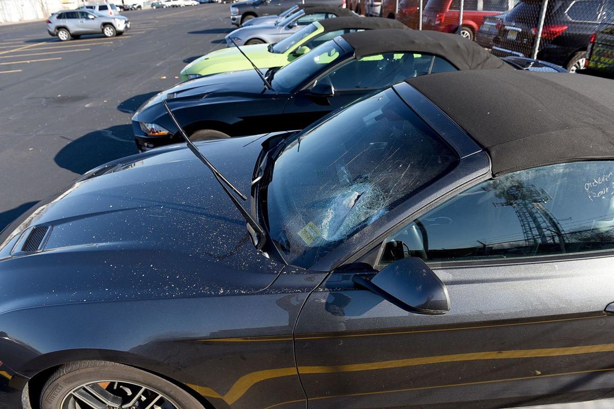 Police say man took an ax to cars at rental-car parking ...