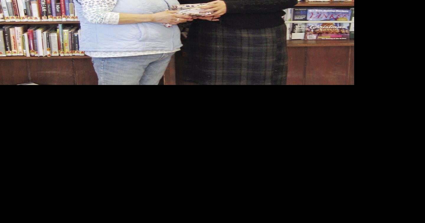 NH Club Notes Meredith Lions donate reading glasses to library