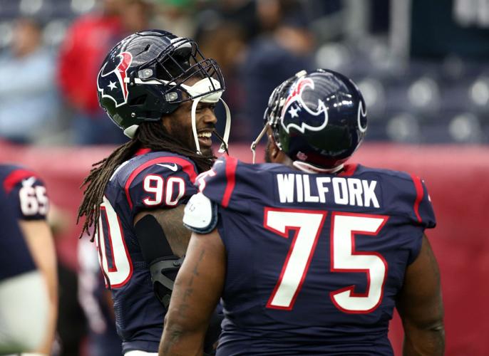 Houston Texans linebackers Jadeveon Clowney, left, and Whitney