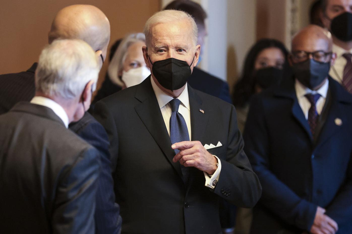 President Joe Biden speaks while greeting Senate pages