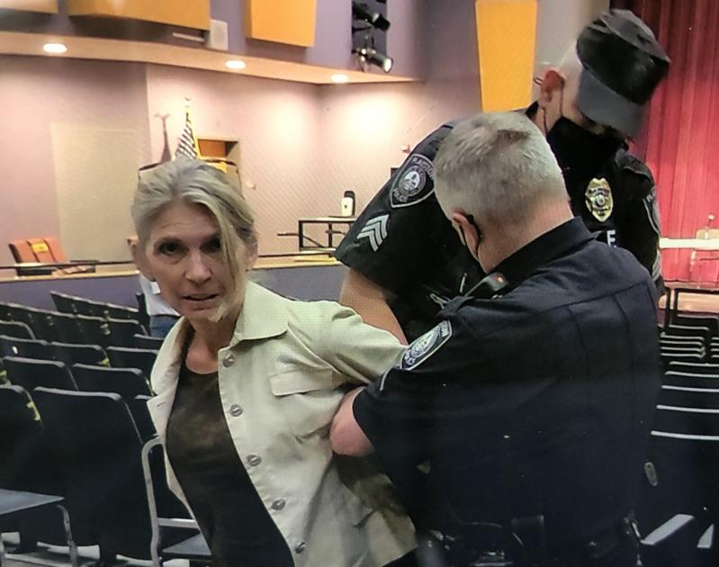 Police arrest unmasked attendee as maskless group shows up at Timberlane school meeting